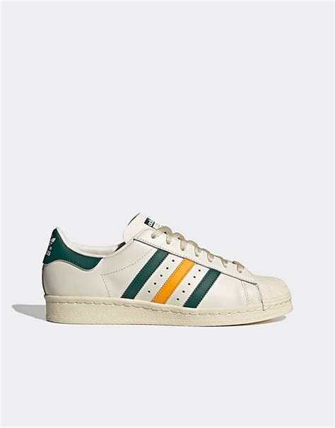 adidas sneaker grün mit gelben streifen|Grüne, gelbe adidas Superstar .